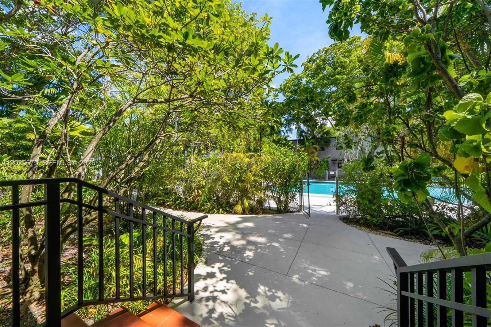 5605 Southwest 80th Street, Unit 10D Miami, FL 33143 - Photo 30 of 43 Back-door access to the pool
