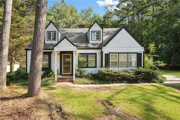 a front view of a house with garden