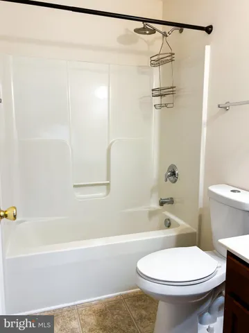 a bathroom with a sink a toilet and a bathtub