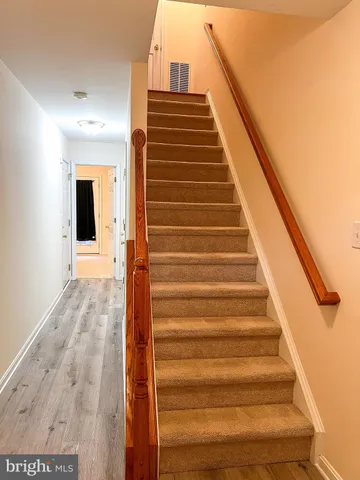 a view of entryway with wooden floor