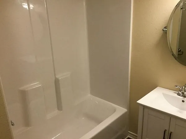 a bathroom with a sink and a tub
