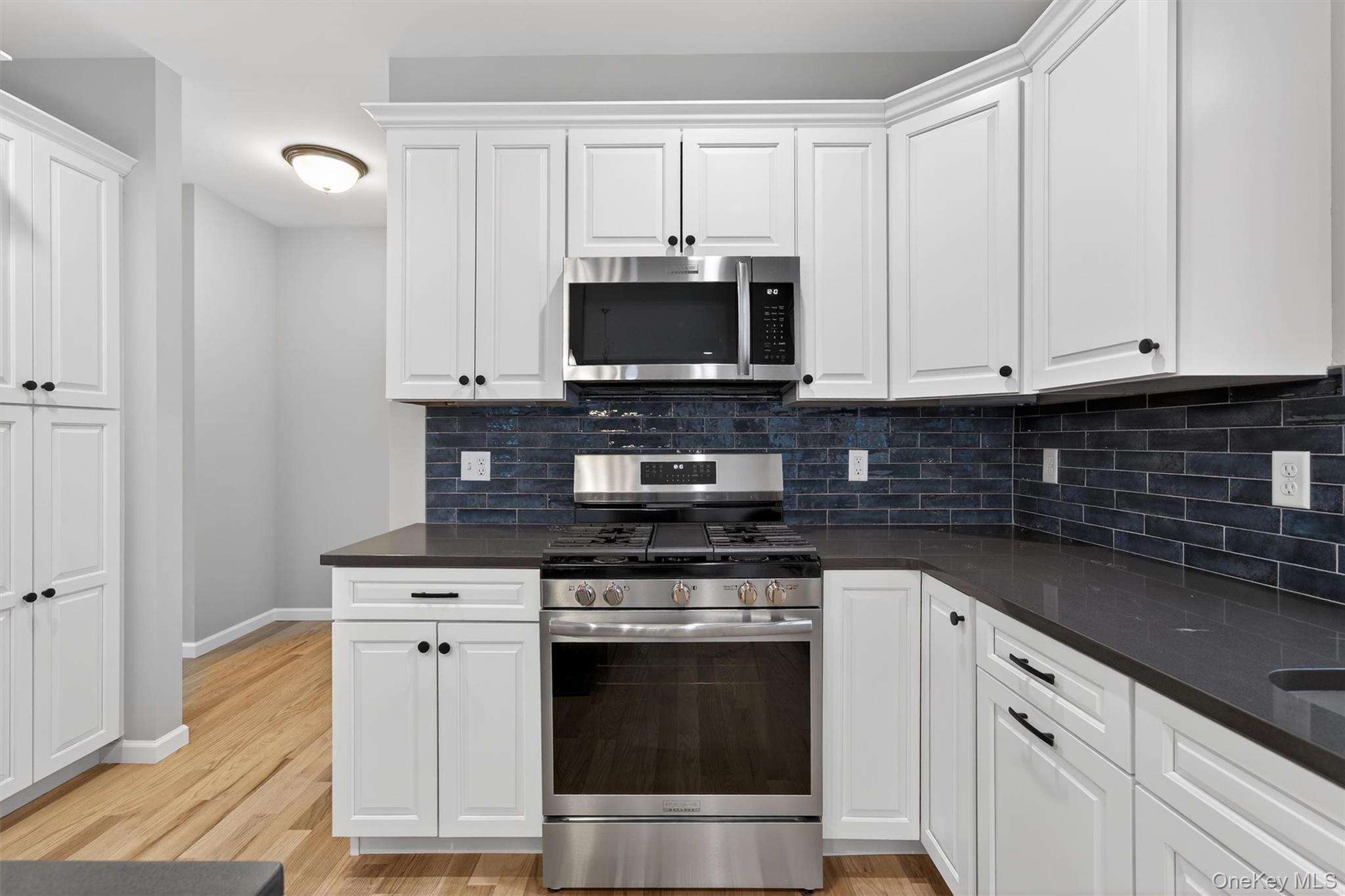 509 Toleman Road Rock Tavern, NY 12575 - Photo 18 of 36 a kitchen with appliances a sink and cabinets