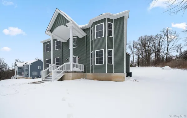 a view of large house with a yard