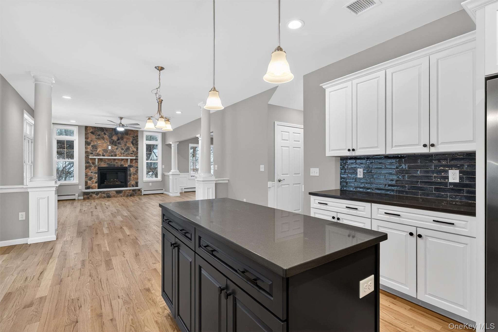 509 Toleman Road Rock Tavern, NY 12575 - Photo 21 of 36 a kitchen with granite countertop a stove a sink and a refrigerator