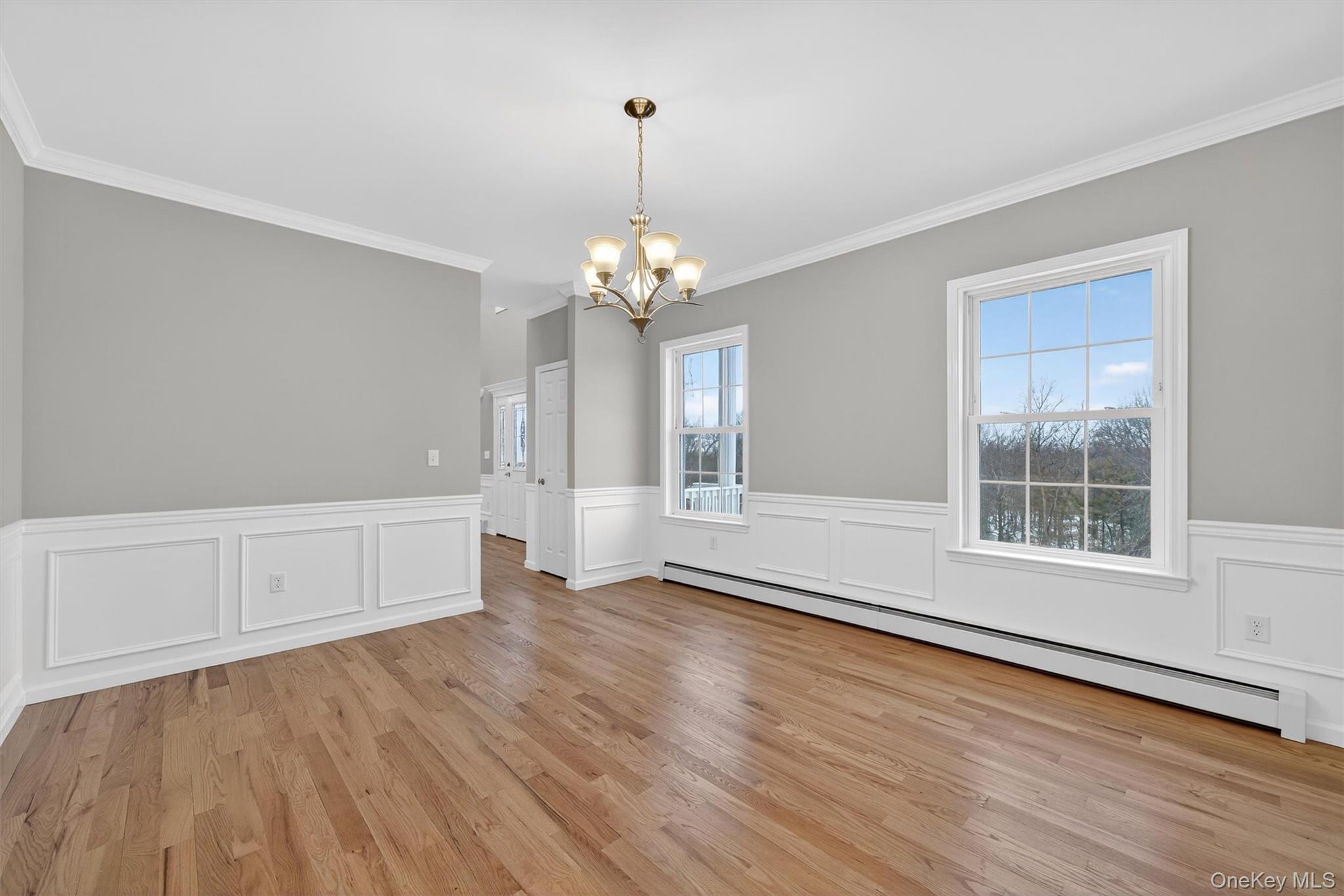 509 Toleman Road Rock Tavern, NY 12575 - Photo 23 of 36 an empty room with wooden floor and windows
