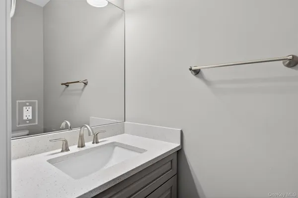 a bathroom with a sink and a mirror