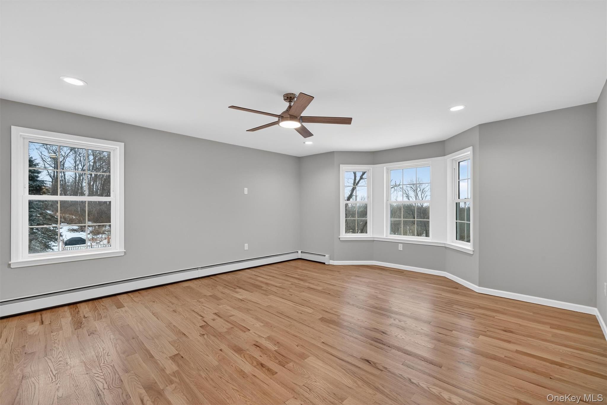 509 Toleman Road Rock Tavern, NY 12575 - Photo 29 of 36 a view of an empty room with a window and wooden floor