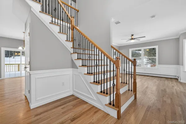 a view of entryway with wooden floor