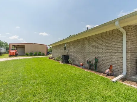 a white toilet sitting next to a bathroom sink