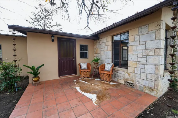 a backyard of a house with seating space