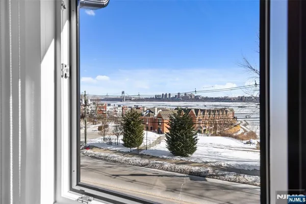 a view of a balcony next to a yard