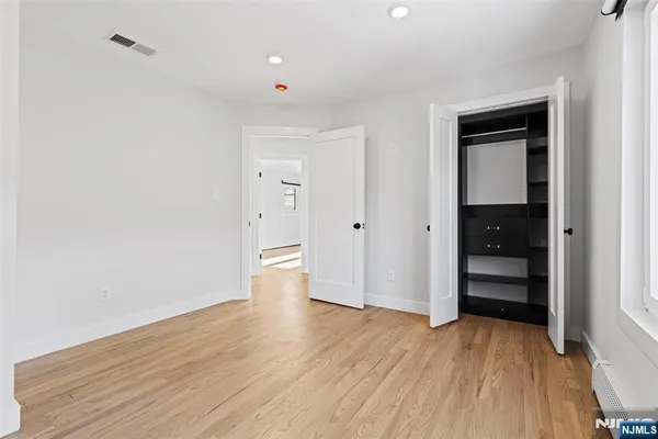 a bathroom with a toilet a sink a vanity and mirror