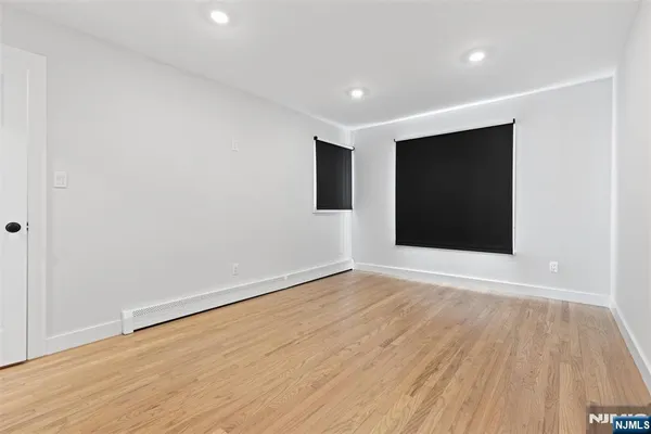 a bathroom with a sink toilet and mirror
