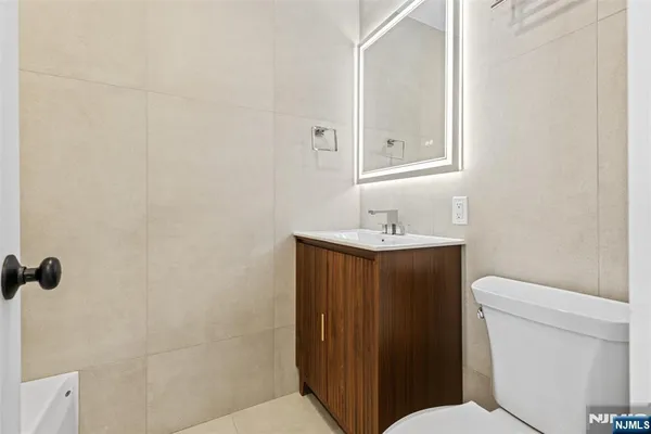 a bathroom with a shower and a sink