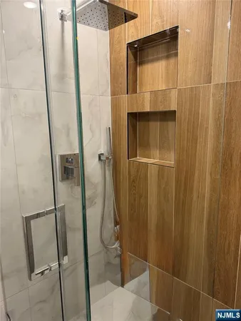 a view of bedroom with wooden floor and white cabinet