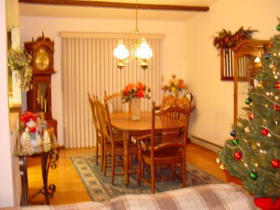 2465 Evanwood Road Bath, PA 18014 - Photo 2 of 3 DINING ROOM WITH HARDWOOD FLOOR AND SLIDING GLASS DOOR OPENING ONTO L-SHAPED DECK.