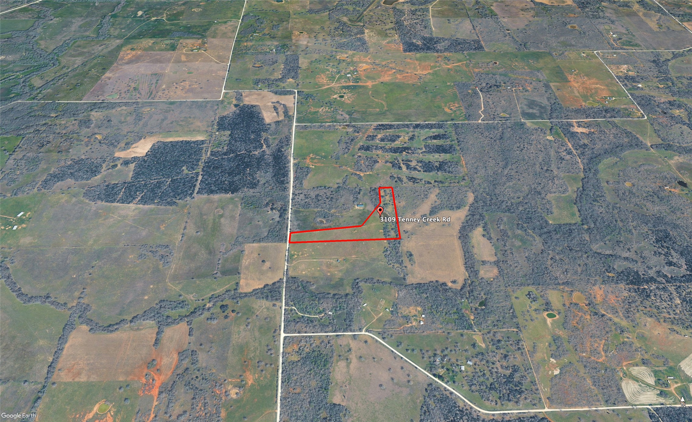 3109 Tenney Creek Road Dale, TX 78616 - Photo 8 of 23 An aerial perspective showcases a vast, undeveloped rural landscape perfect for agricultural pursuits or private estate development.