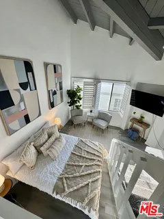 a living room with furniture rug and white walls
