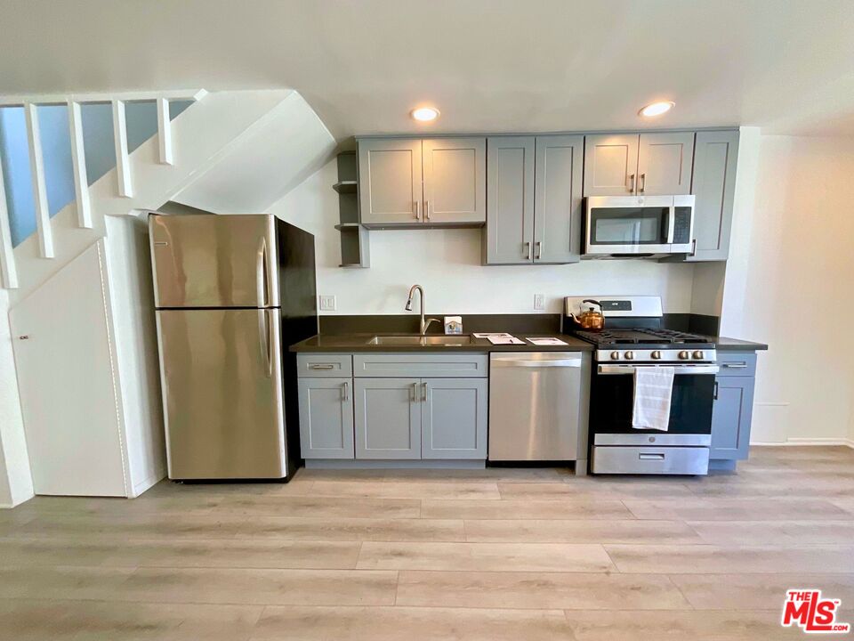 14 Mast Street Marina del Rey, CA 90292 - Photo 22 of 32 a kitchen with a refrigerator and a sink