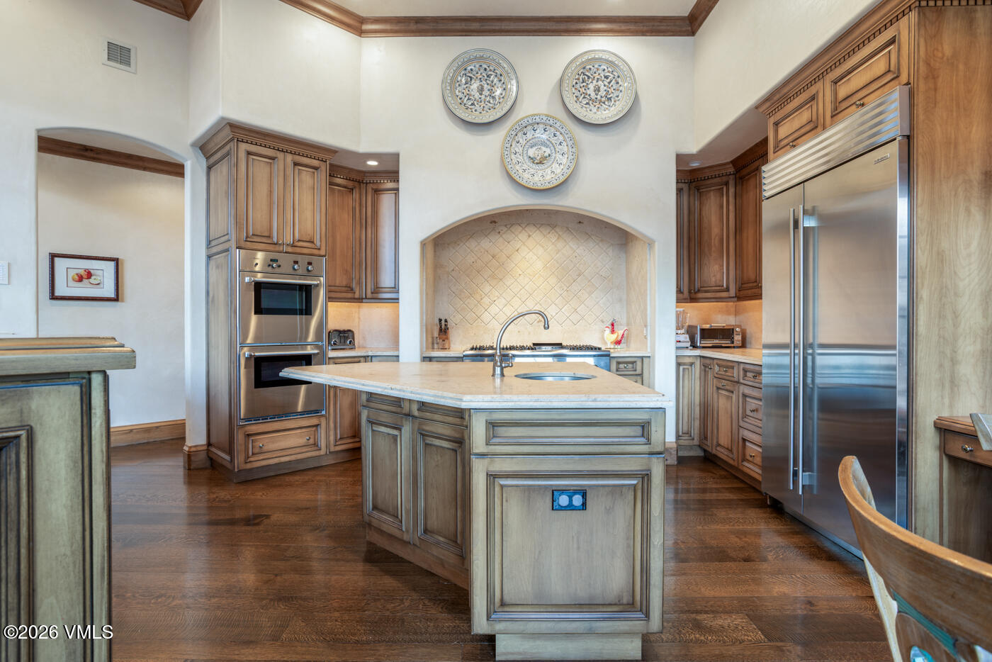 312 Holden Road Beaver Creek, CO 81620 - Photo 16 of 45 a hall with wooden floor and a clock on a wall