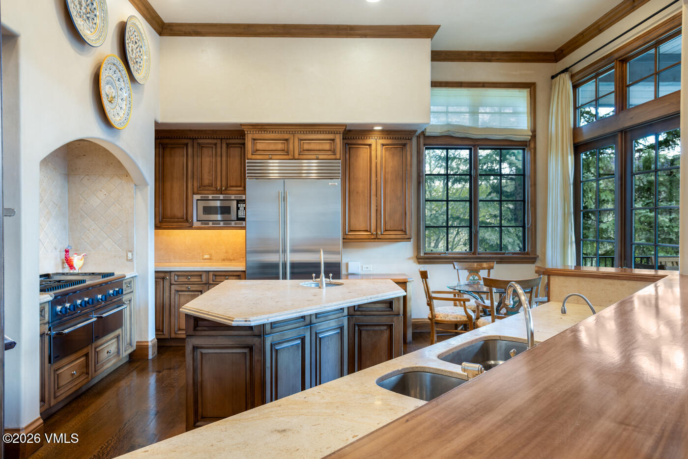 312 Holden Road Beaver Creek, CO 81620 - Photo 17 of 45 a kitchen with a sink and a stove next to a window