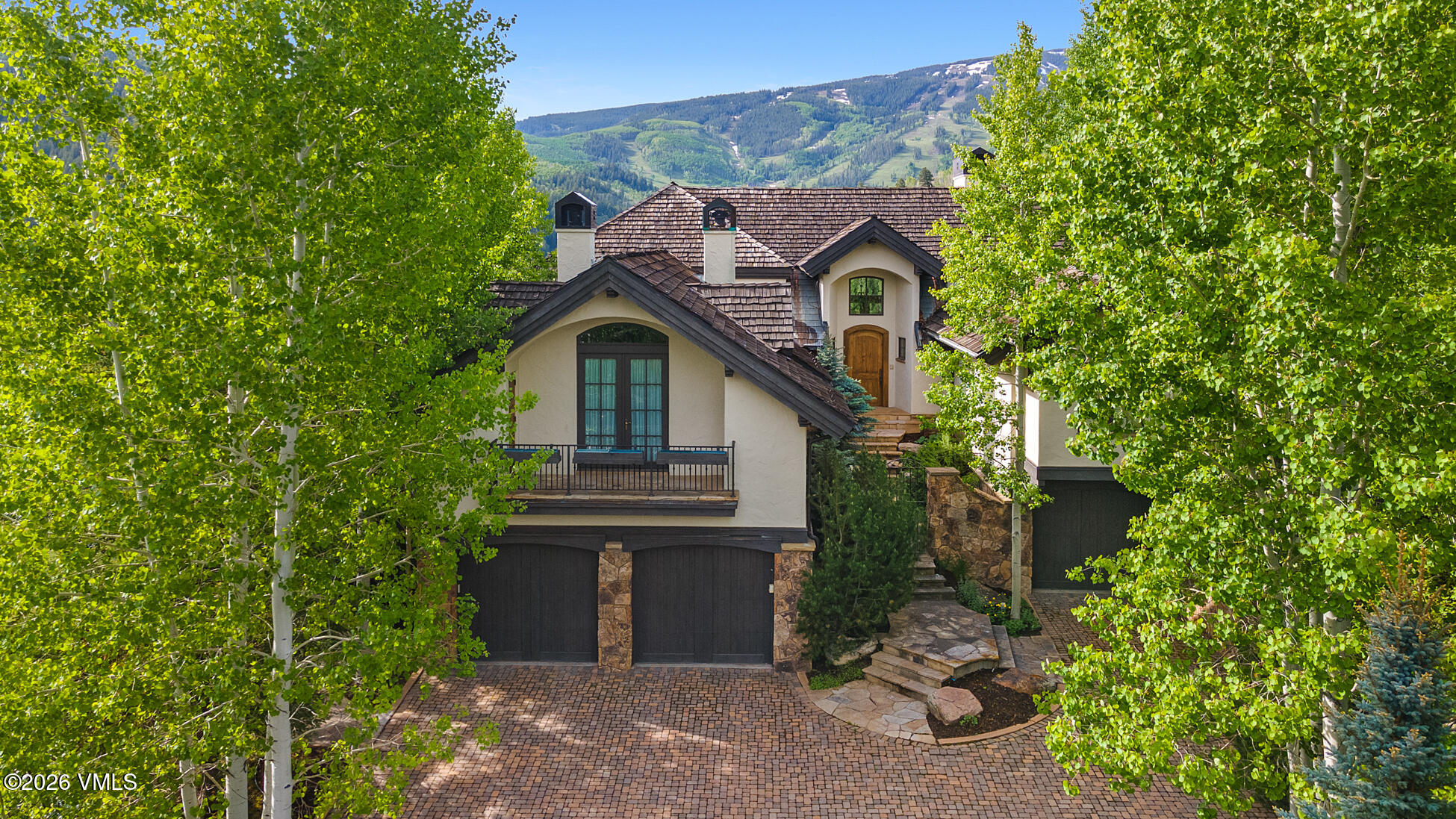 312 Holden Road Beaver Creek, CO 81620 - Photo 2 of 45 a front view of a house with garden