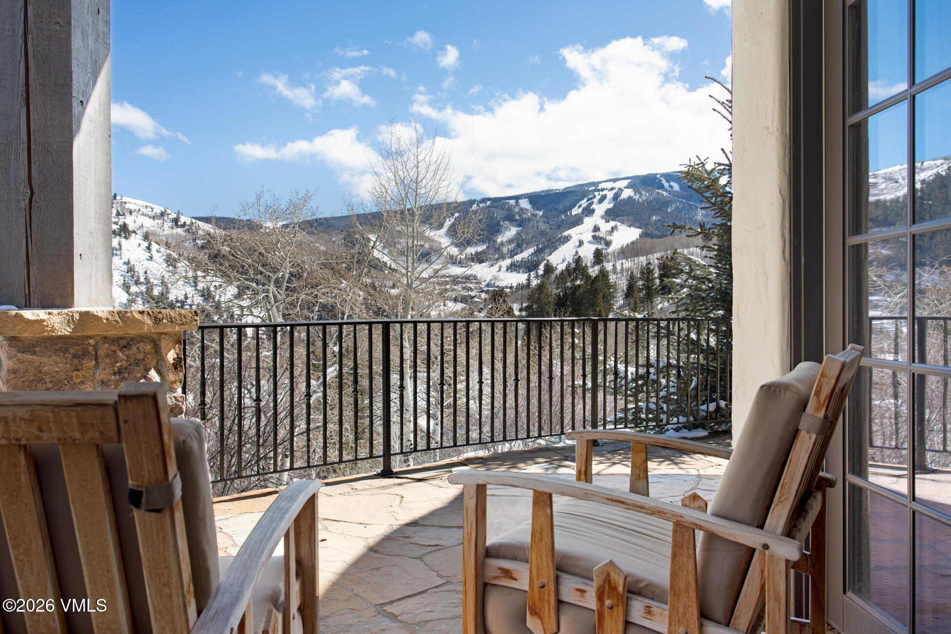 312 Holden Road Beaver Creek, CO 81620 - Photo 21 of 45 a view of a balcony with chair and iron fence