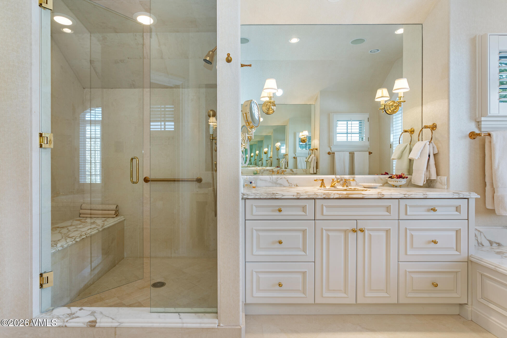312 Holden Road Beaver Creek, CO 81620 - Photo 25 of 45 a bathroom with a granite countertop sink mirror and shower