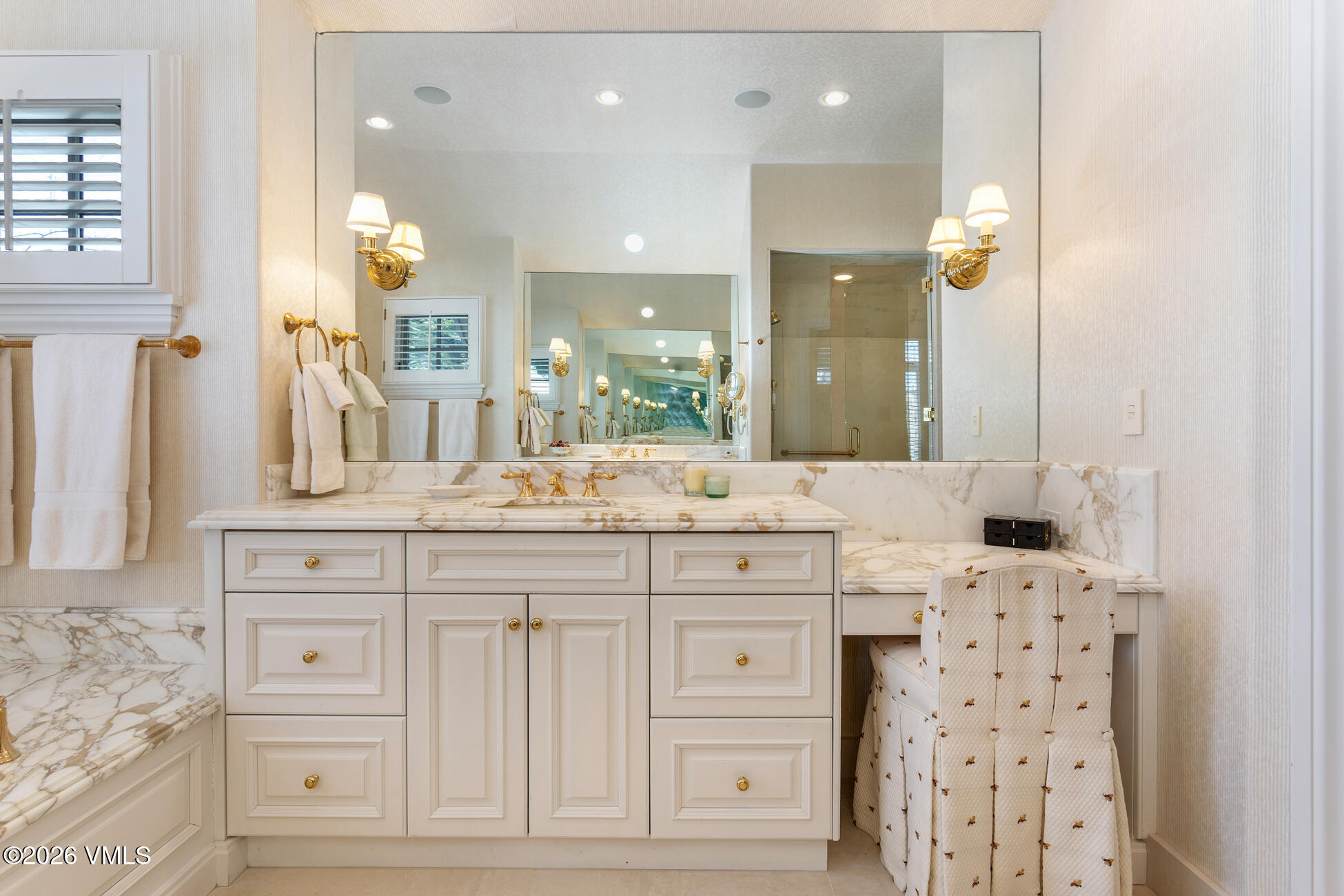 312 Holden Road Beaver Creek, CO 81620 - Photo 26 of 45 a bathroom with a sink vanity granite tub and a mirror
