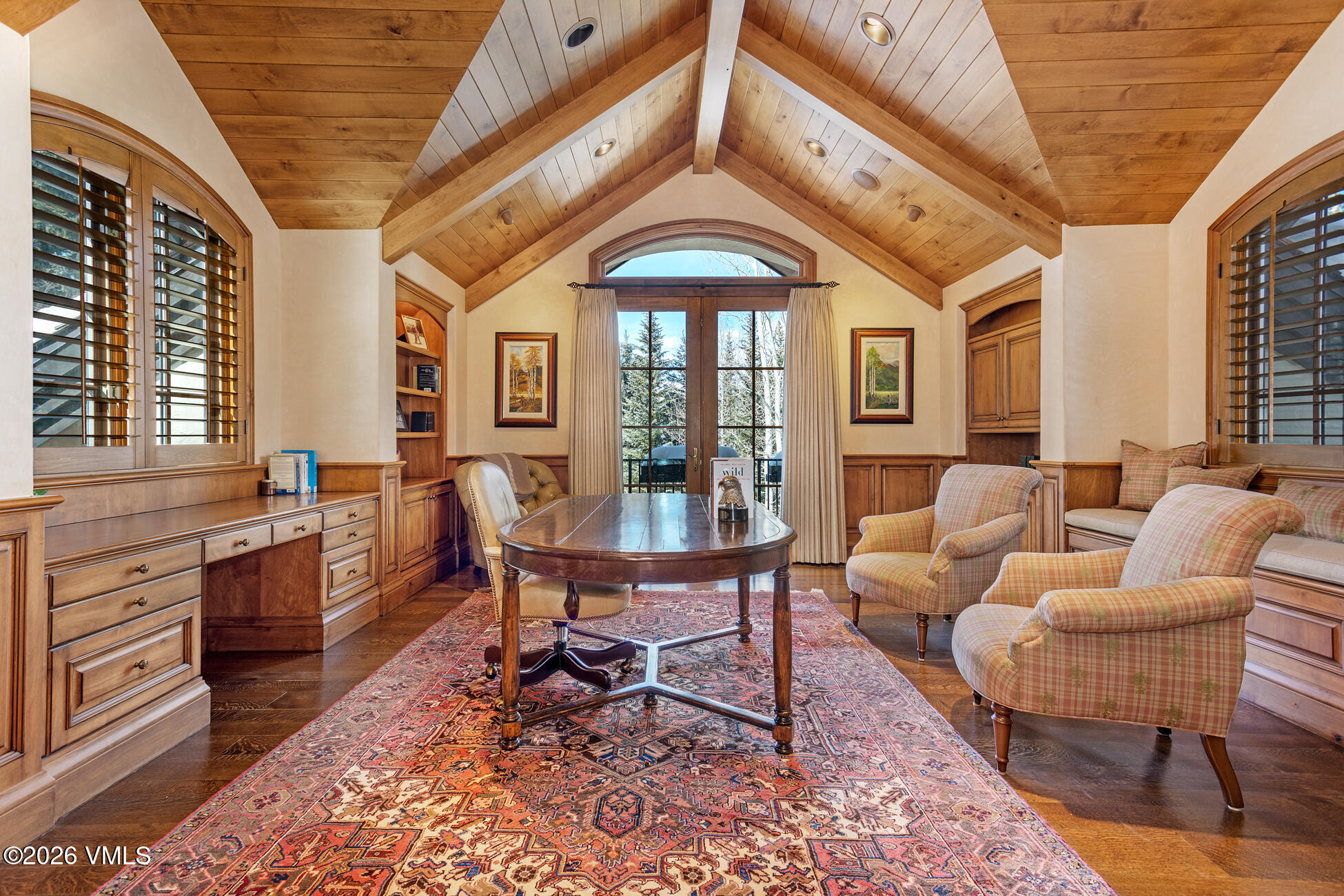 312 Holden Road Beaver Creek, CO 81620 - Photo 28 of 45 a living room with furniture a dining table and a floor to ceiling window