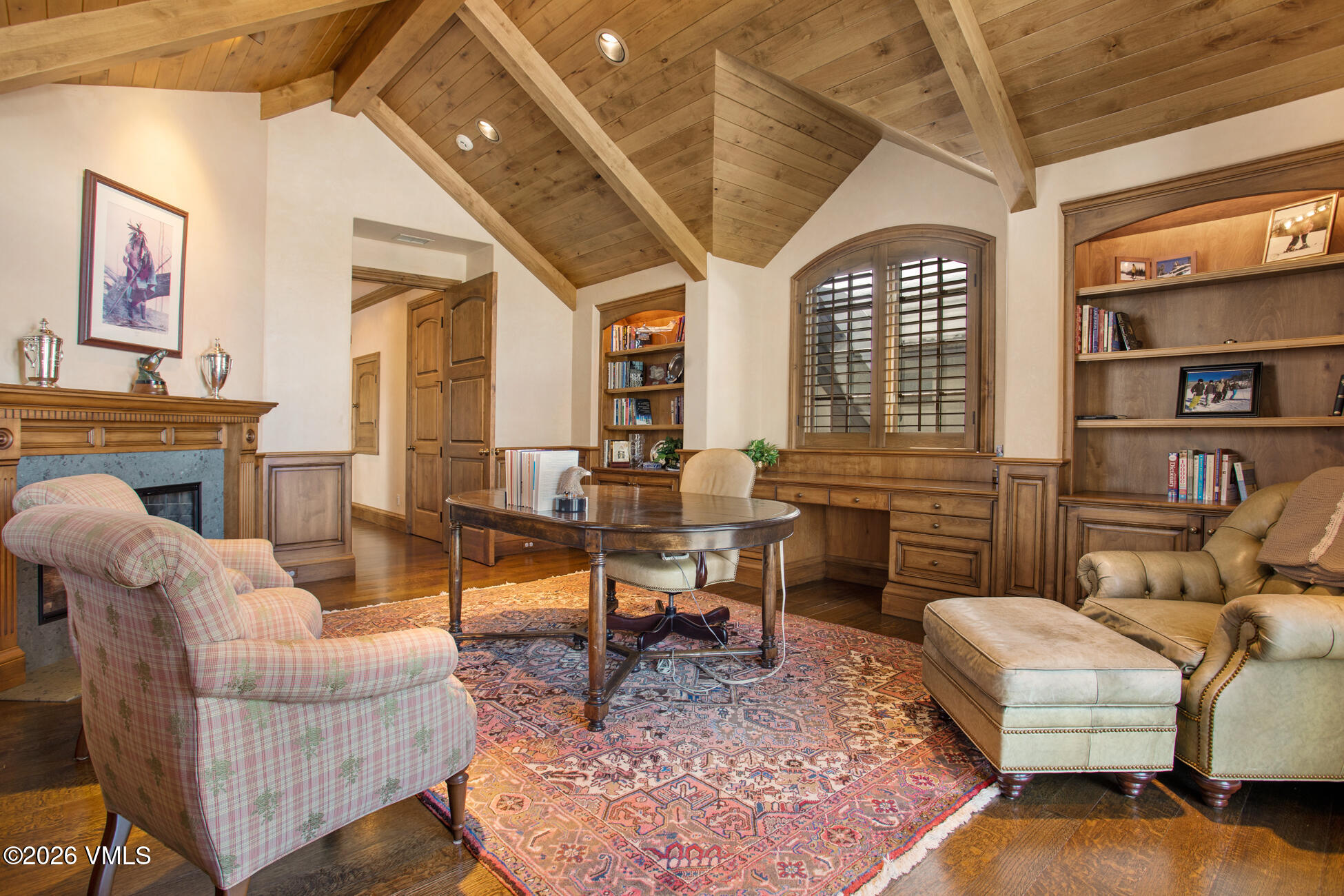 312 Holden Road Beaver Creek, CO 81620 - Photo 30 of 45 a living room with furniture a rug and a fireplace
