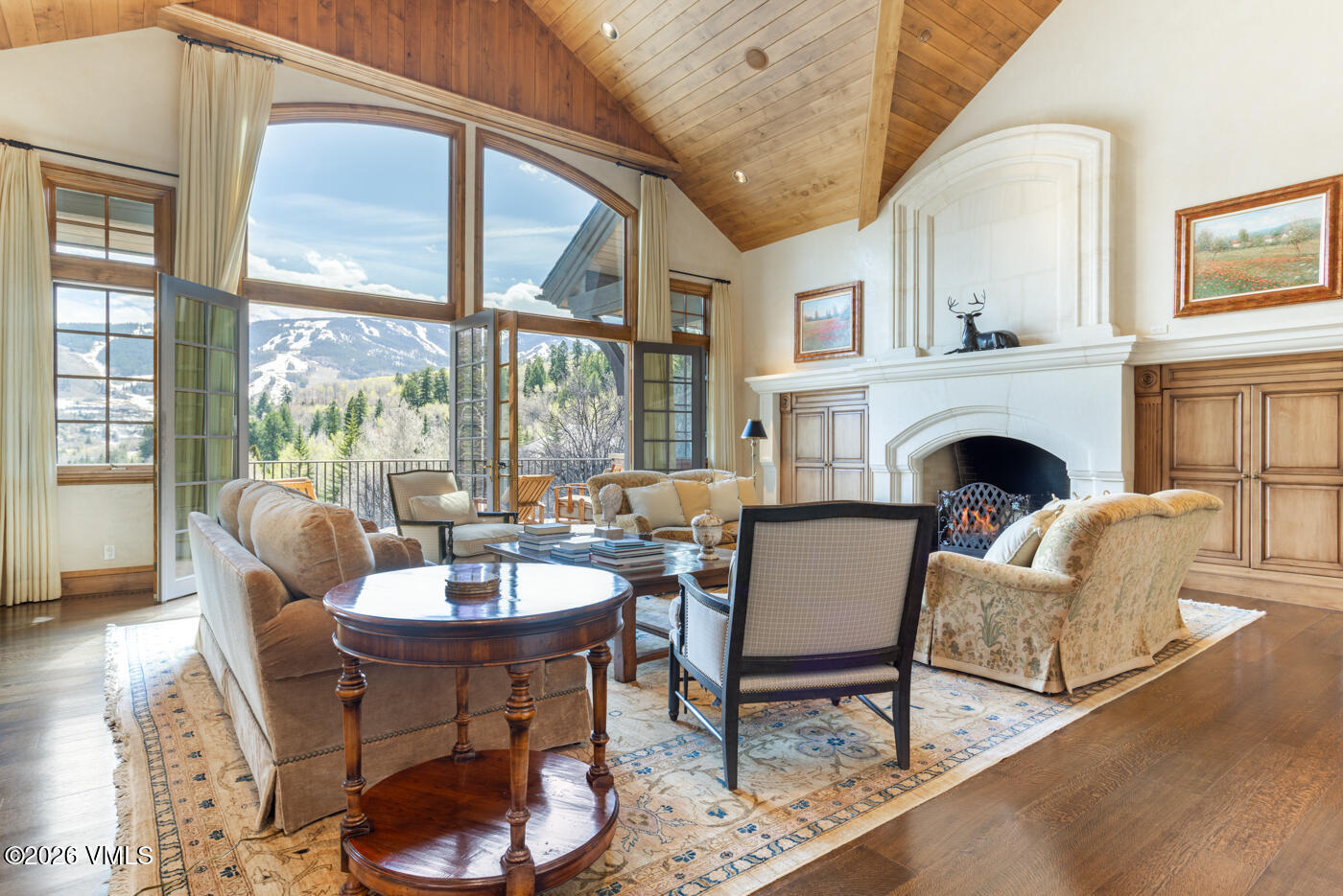 312 Holden Road Beaver Creek, CO 81620 - Photo 3 of 45 a living room with fireplace furniture and a large window