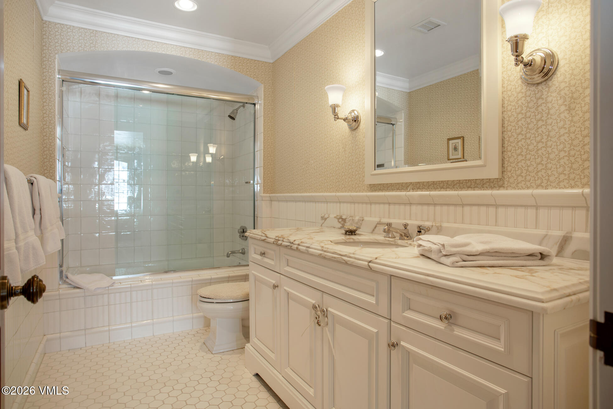 312 Holden Road Beaver Creek, CO 81620 - Photo 35 of 45 a bathroom with a granite countertop sink toilet mirror and shower