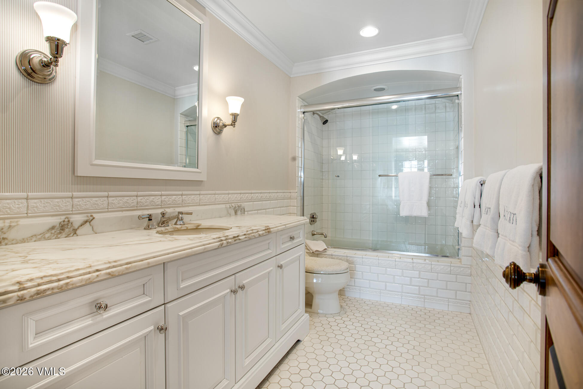 312 Holden Road Beaver Creek, CO 81620 - Photo 37 of 45 a bathroom with a granite countertop sink toilet and shower