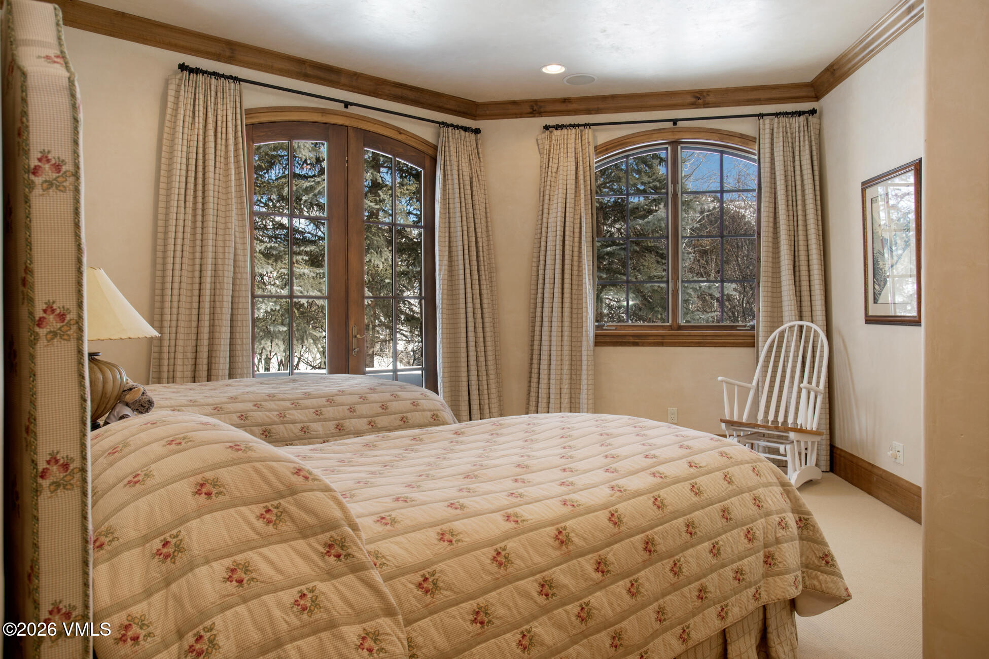 312 Holden Road Beaver Creek, CO 81620 - Photo 40 of 45 a bedroom with a large bed and a large window