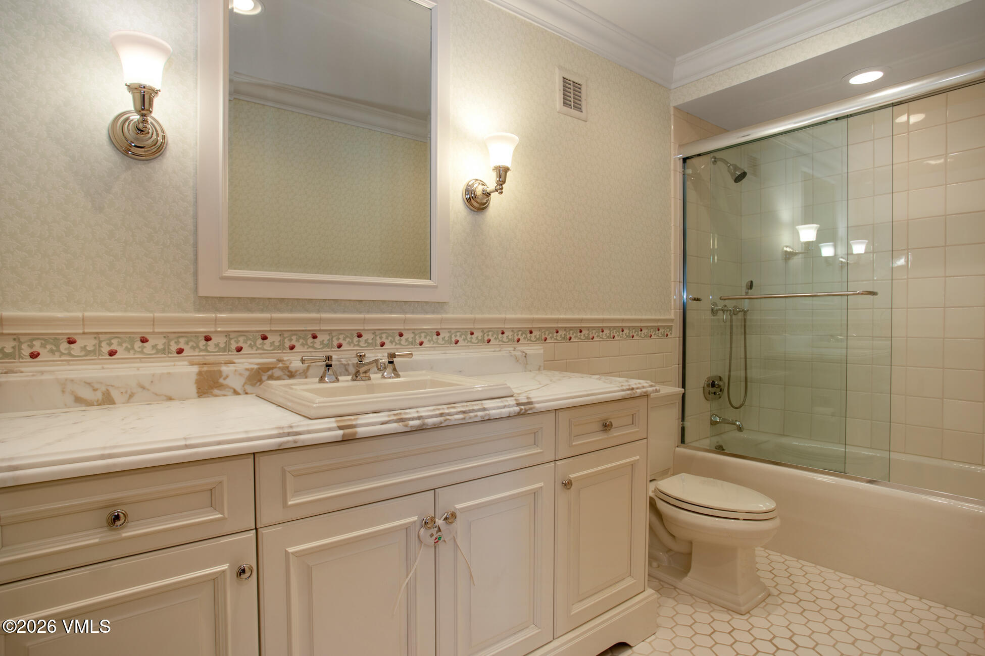 312 Holden Road Beaver Creek, CO 81620 - Photo 42 of 45 a bathroom with a granite countertop toilet a sink and a mirror