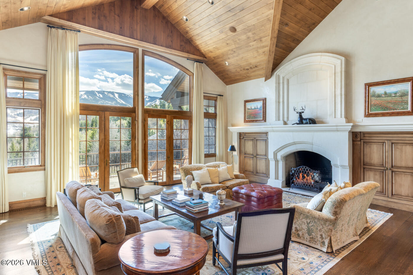 312 Holden Road Beaver Creek, CO 81620 - Photo 5 of 45 a living room with furniture fireplace and large windows