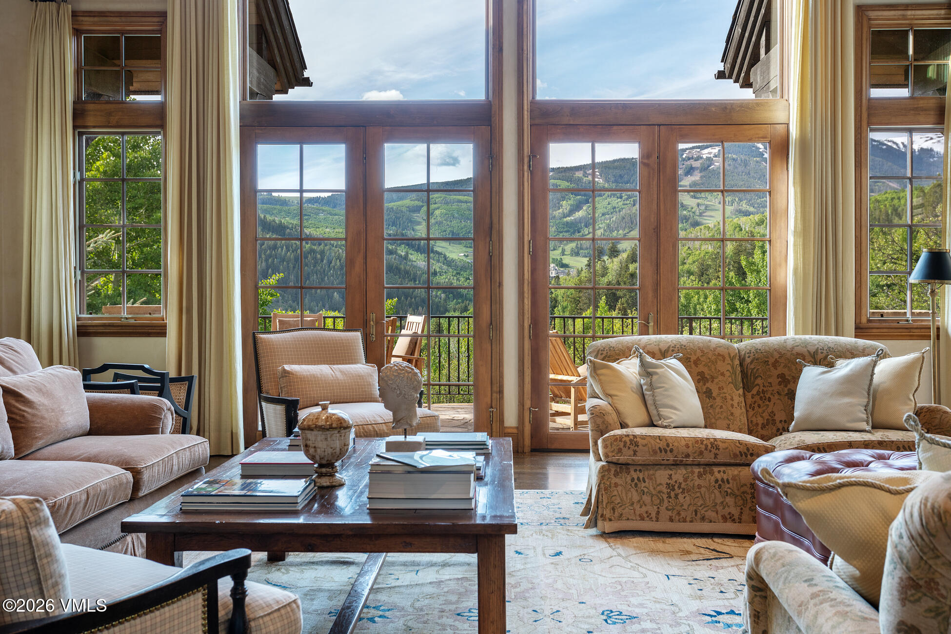 312 Holden Road Beaver Creek, CO 81620 - Photo 6 of 45 a living room with furniture and a large window