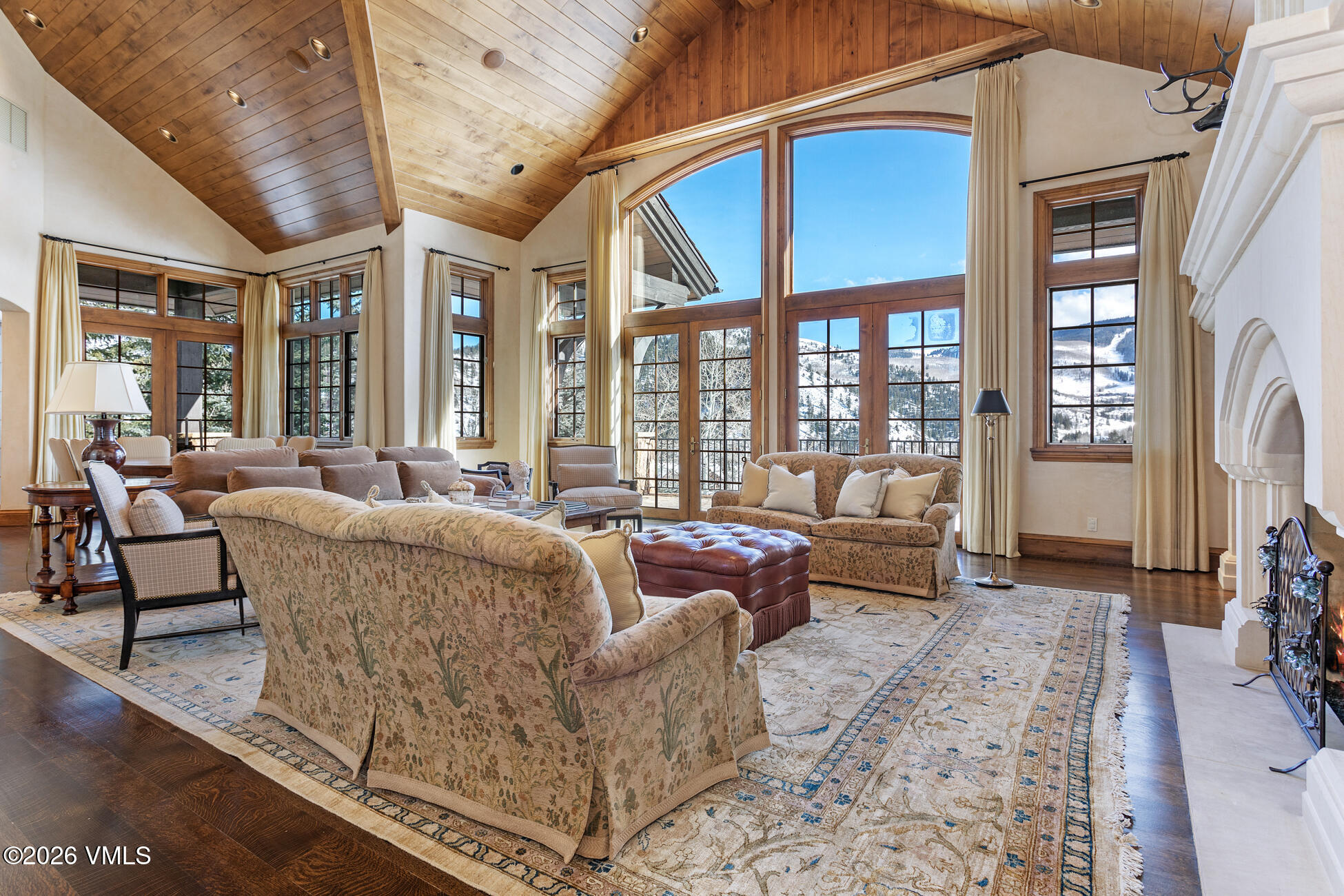 312 Holden Road Beaver Creek, CO 81620 - Photo 8 of 45 a living room with furniture and a floor to ceiling window