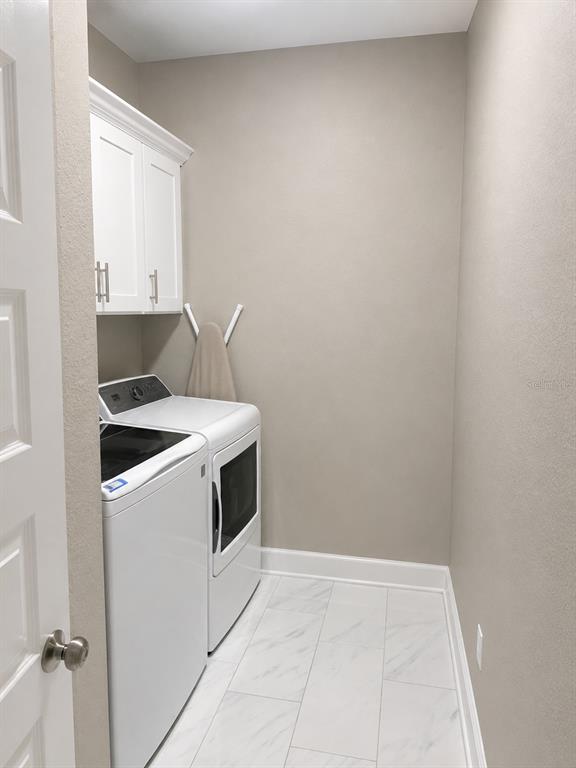 3834 Charter Road Lakeland, FL 33810 - Photo 24 of 39 a utility room with dryer and washer