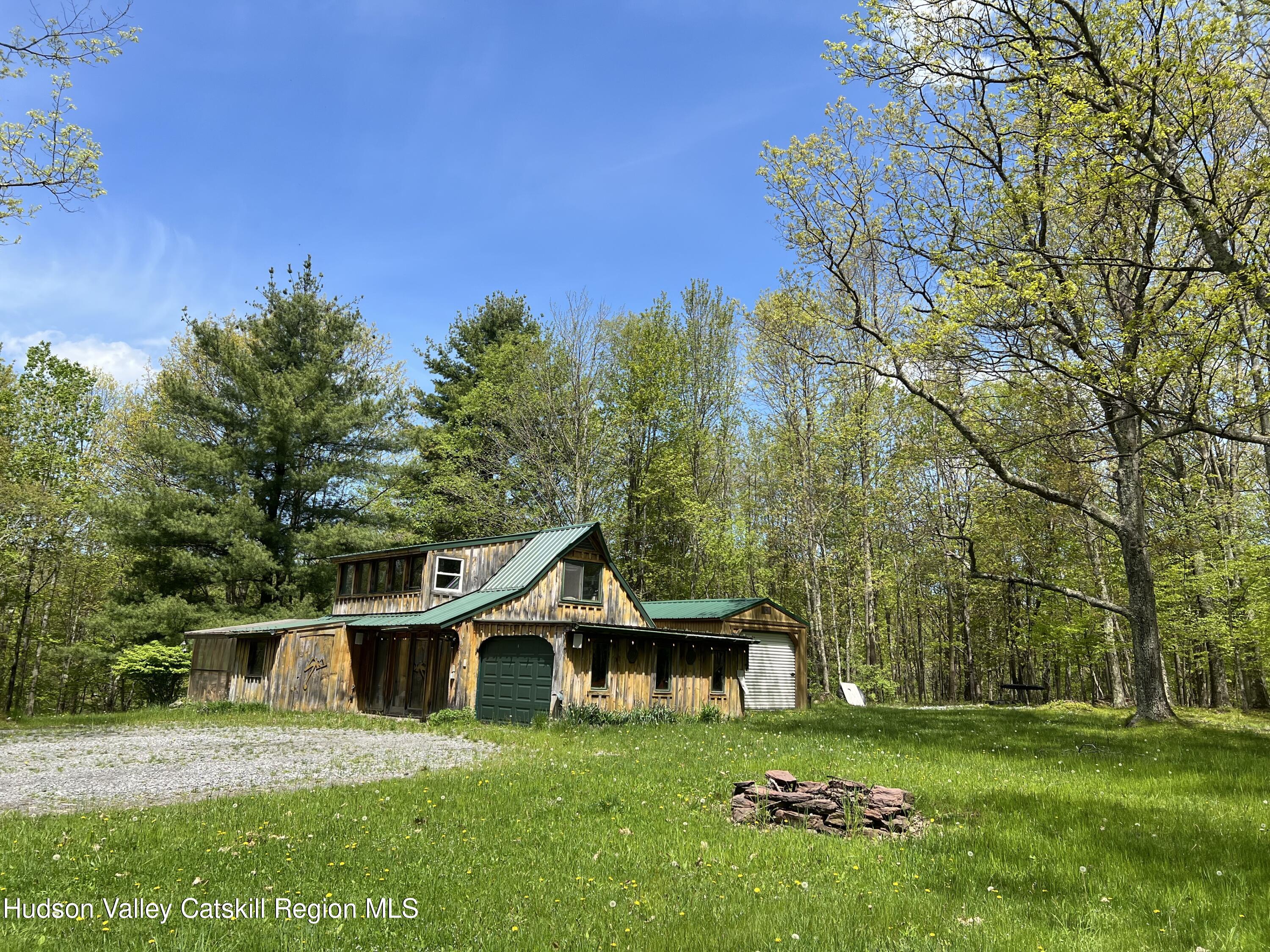 978 Scott Greene Road Roxbury, NY 12474 - Photo 15 of 41 a front view of a house with garden