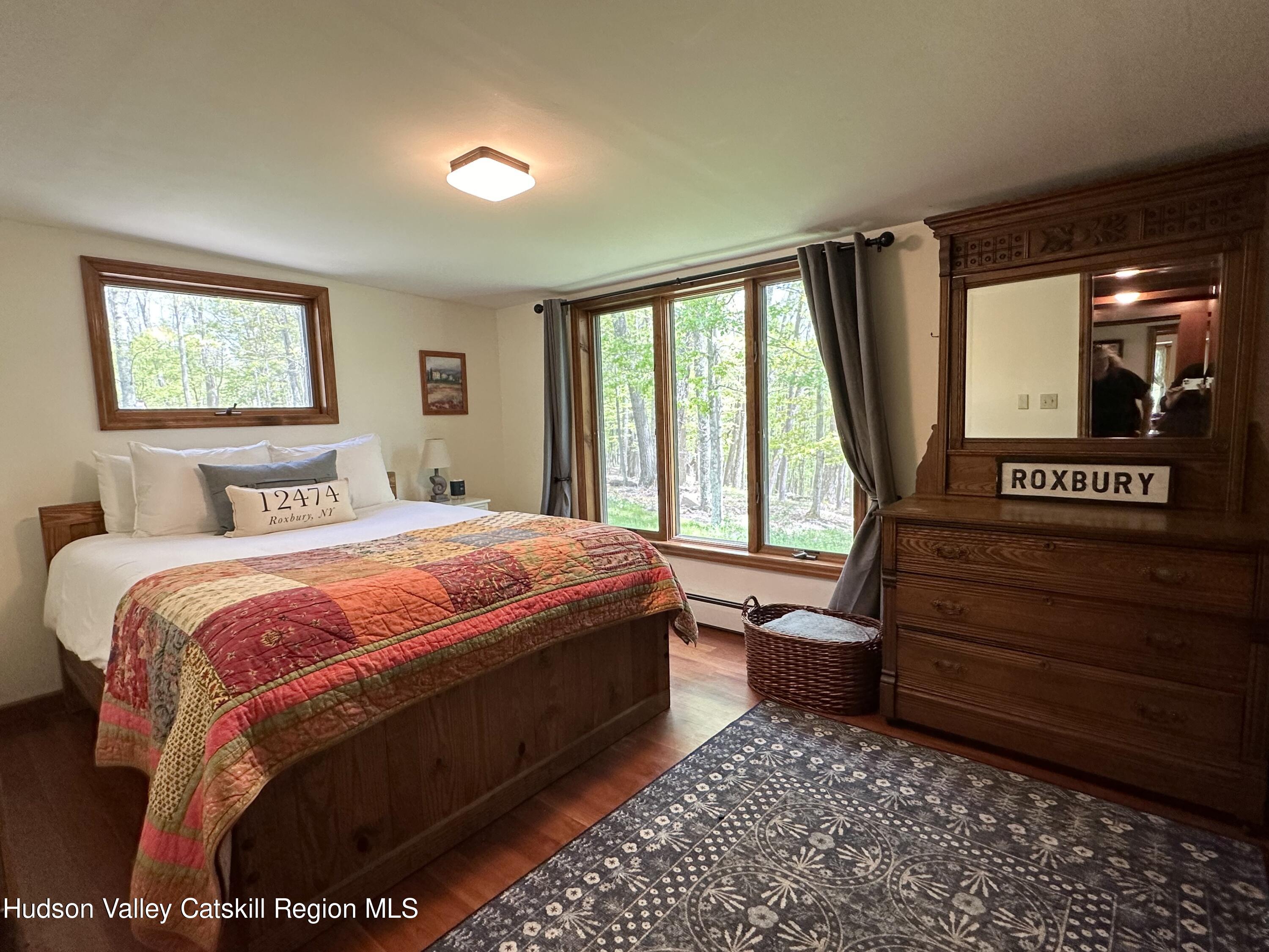 978 Scott Greene Road Roxbury, NY 12474 - Photo 17 of 41 a bedroom with a bed and a window