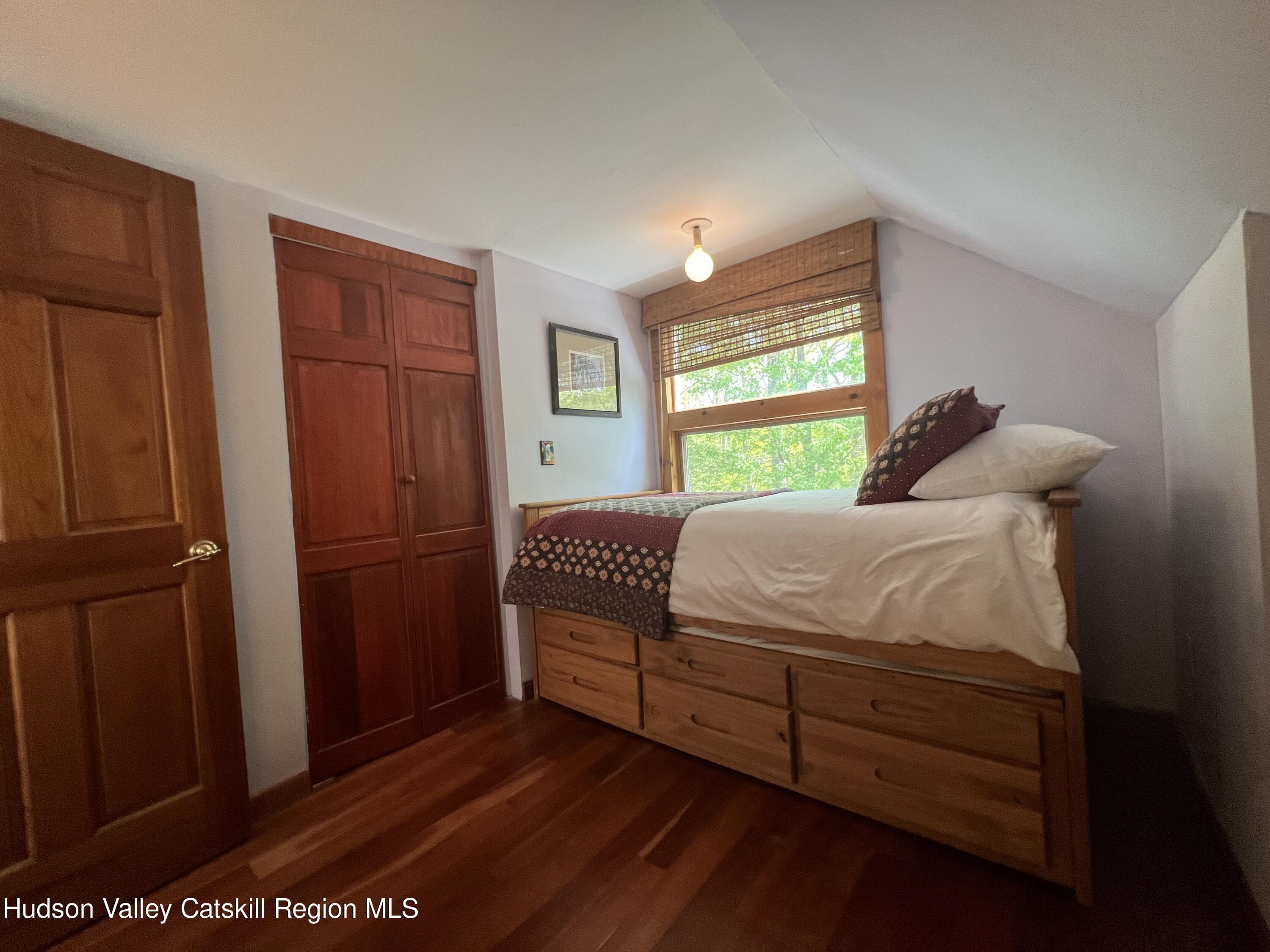 978 Scott Greene Road Roxbury, NY 12474 - Photo 24 of 41 a bedroom with a bed and a dresser