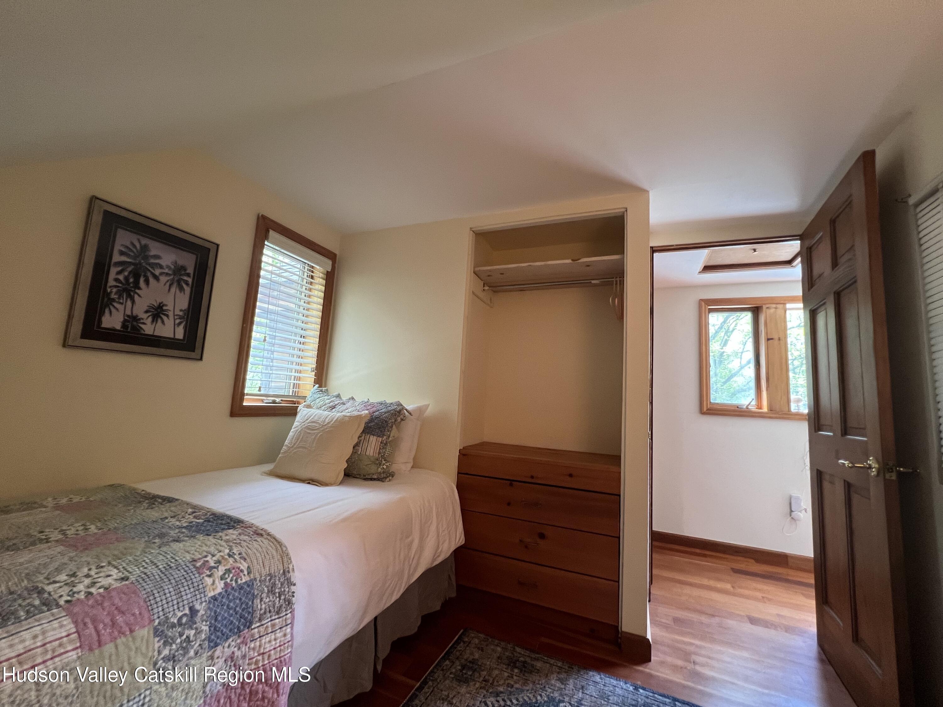 978 Scott Greene Road Roxbury, NY 12474 - Photo 25 of 41 a bedroom with a bed and a window