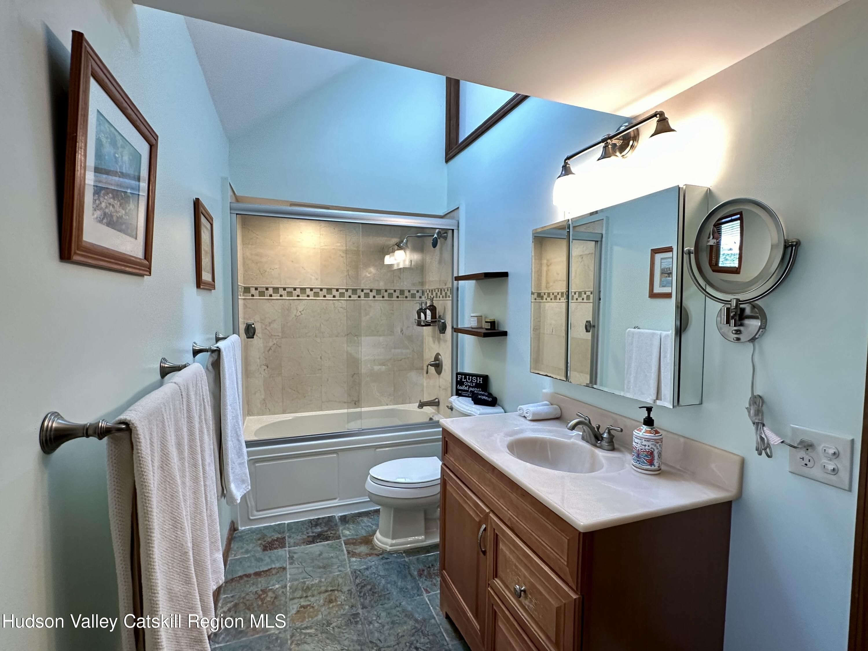 978 Scott Greene Road Roxbury, NY 12474 - Photo 27 of 41 a bathroom with a sink a toilet and a shower