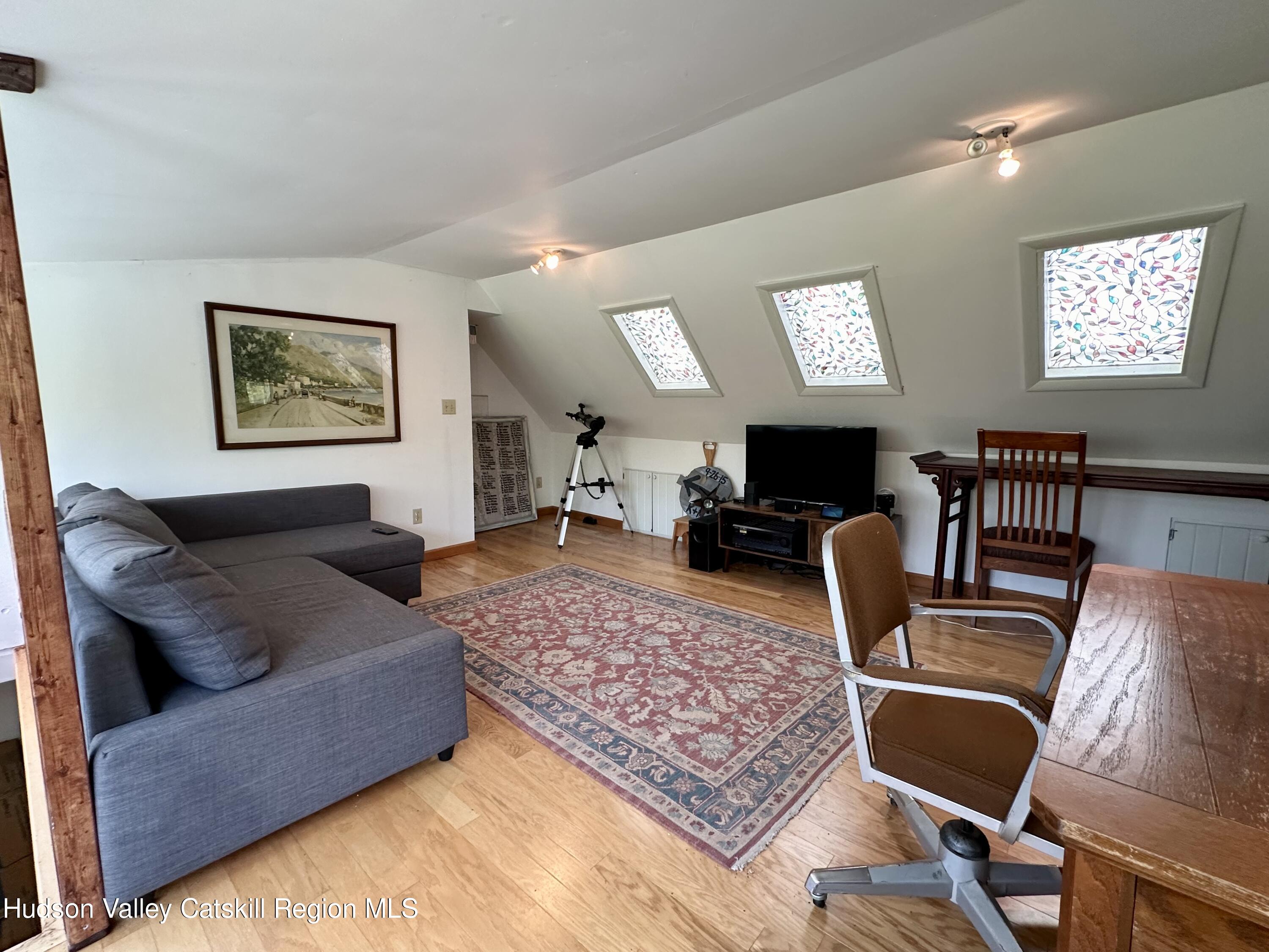 978 Scott Greene Road Roxbury, NY 12474 - Photo 31 of 41 a living room with furniture rug and window
