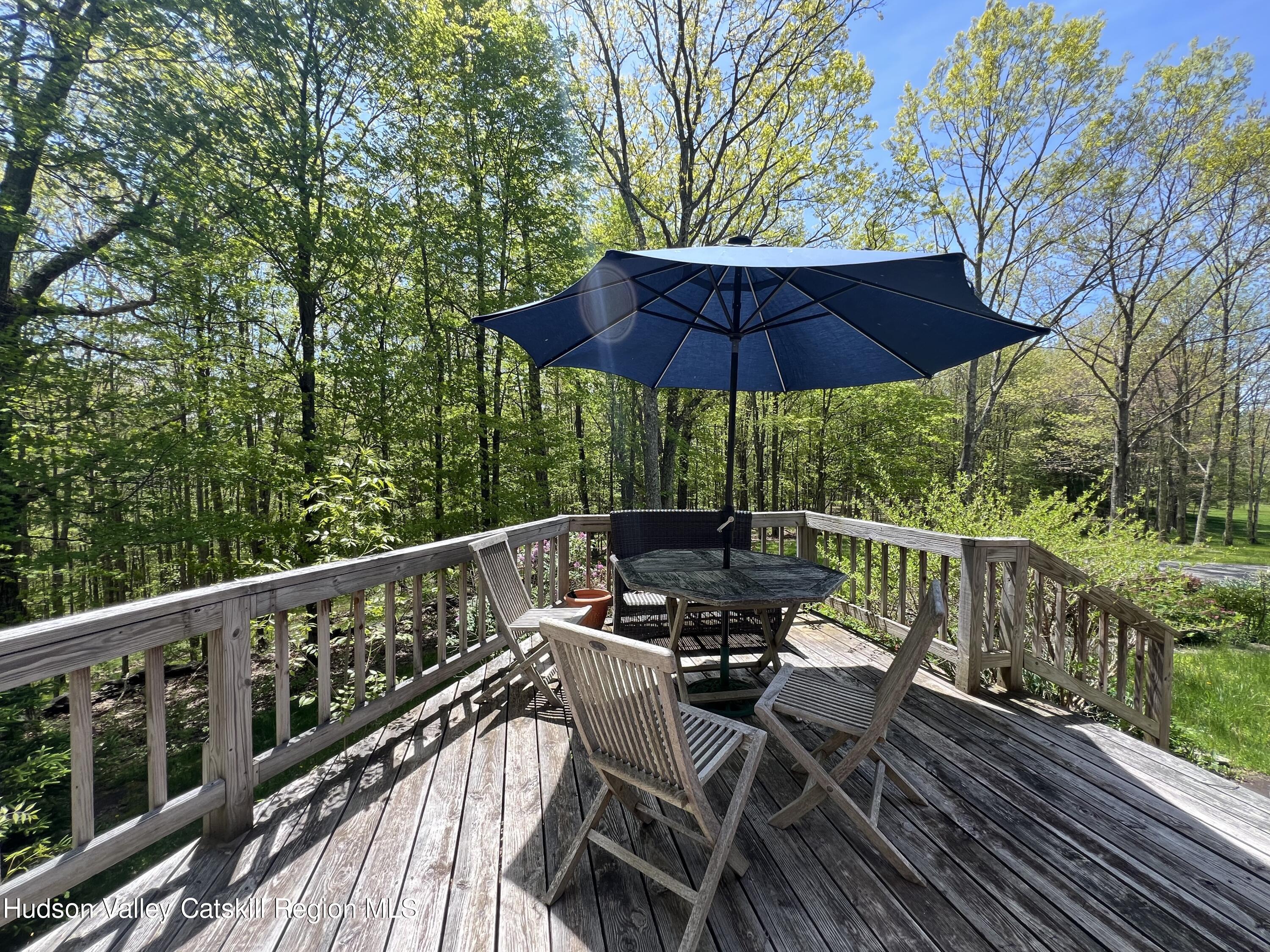 978 Scott Greene Road Roxbury, NY 12474 - Photo 35 of 41 a view of balcony with outdoor seating and wooden floor