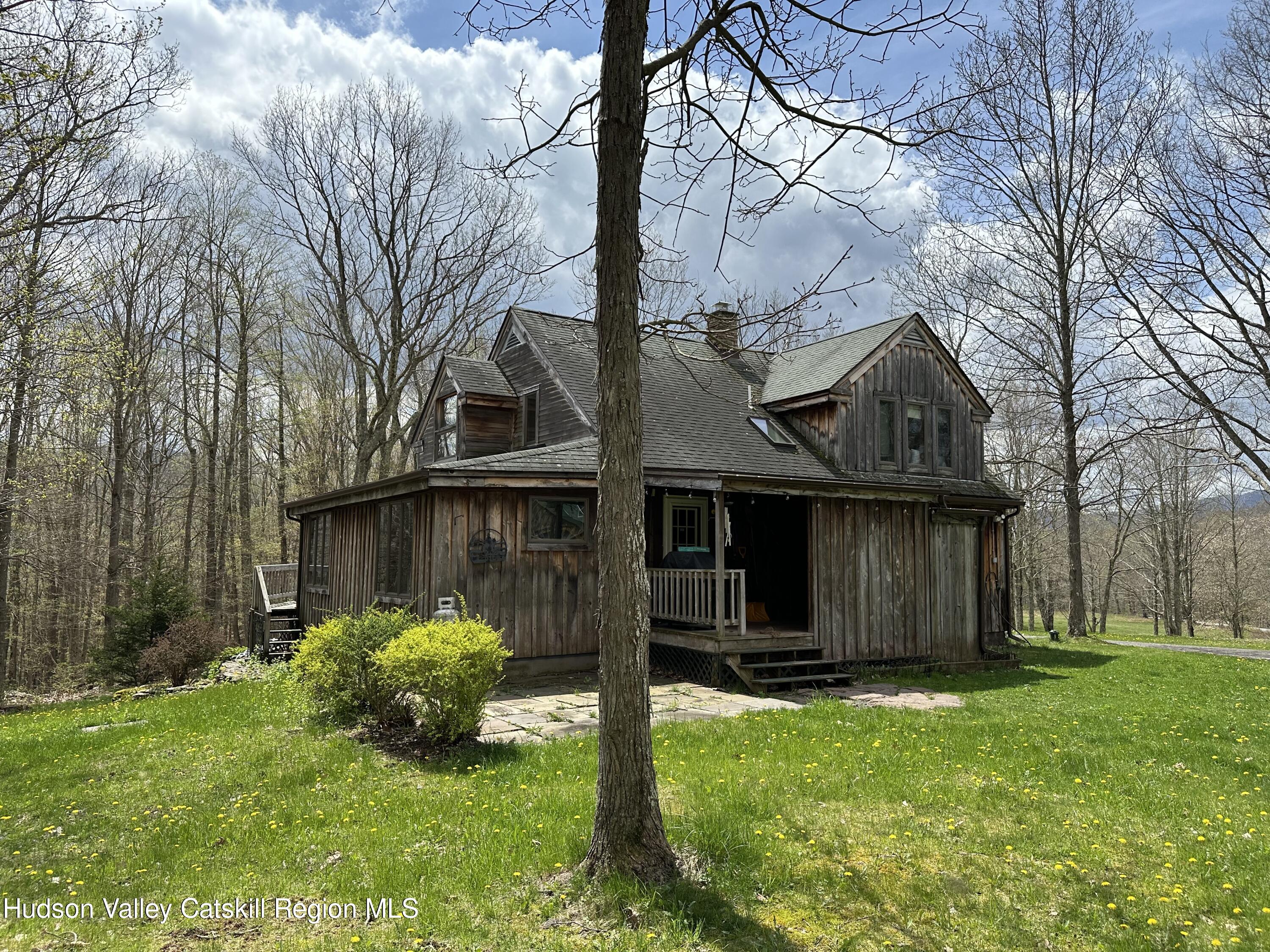 978 Scott Greene Road Roxbury, NY 12474 - Photo 40 of 41 a front view of house with a garden