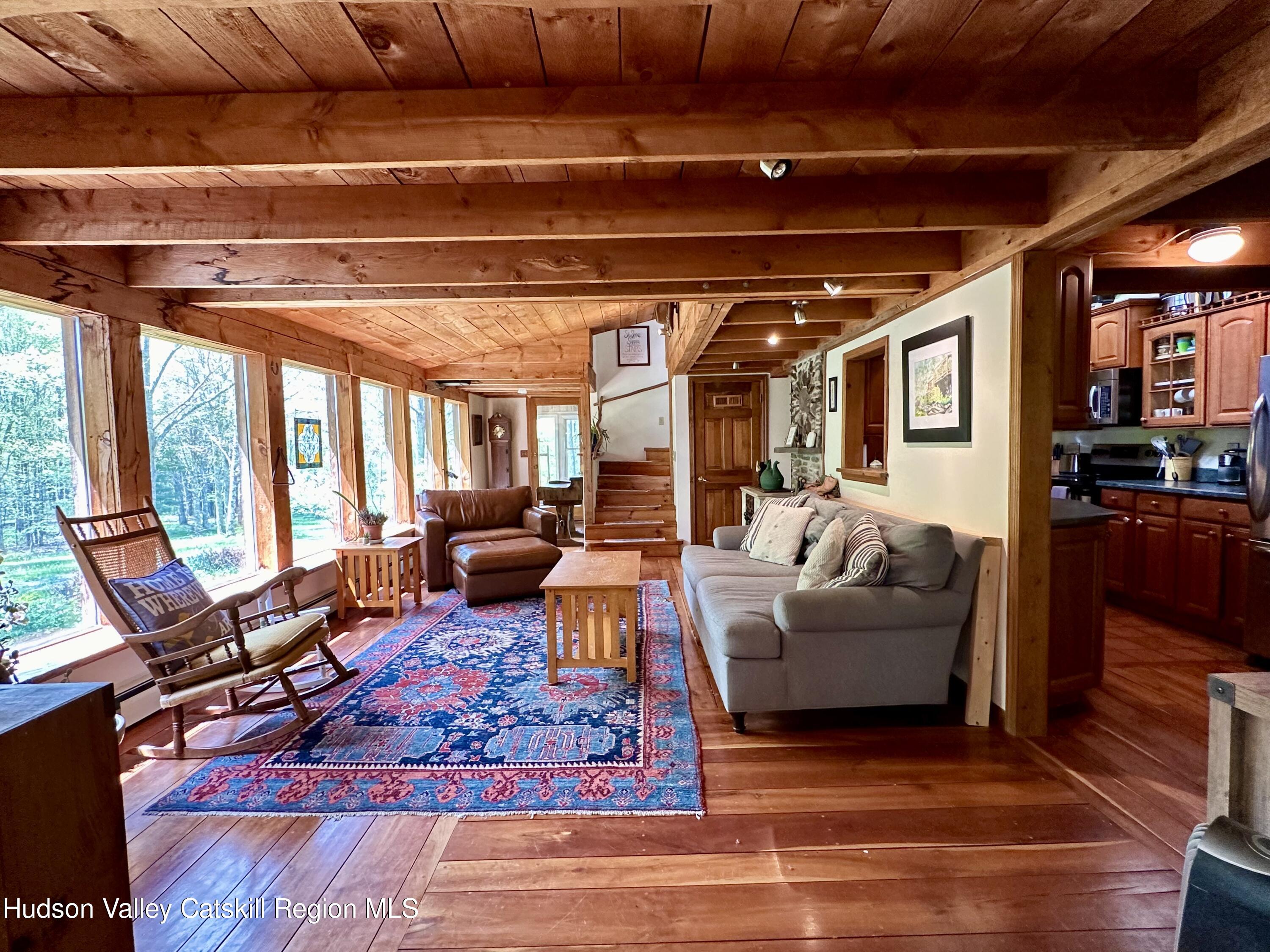 978 Scott Greene Road Roxbury, NY 12474 - Photo 8 of 41 a living room with furniture and a large window