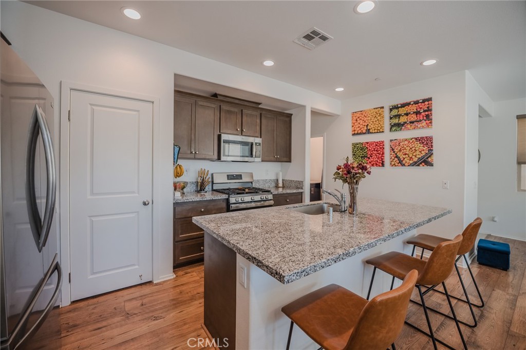 29486 Marx Way Winchester, CA 92596 - Photo 17 of 44 a view of kitchen and dining area with chandelier